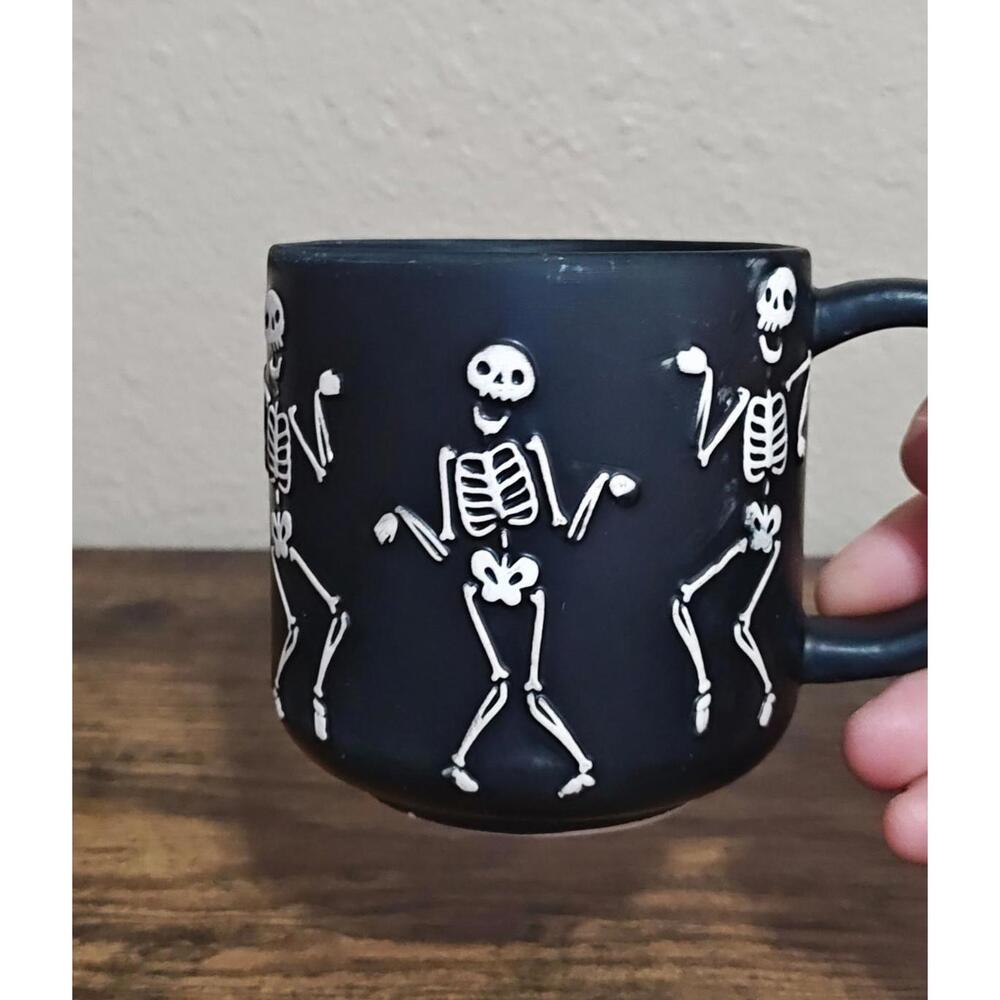 Dancing Skeletons Black Earthenware 13 oz 3D Embossed Black Mug.